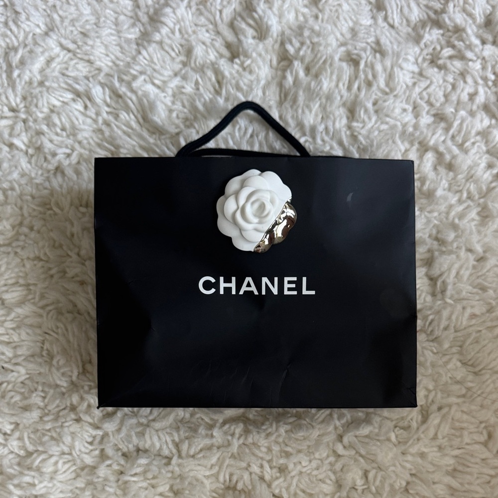 Chanel Black Bag with White Floral Detail